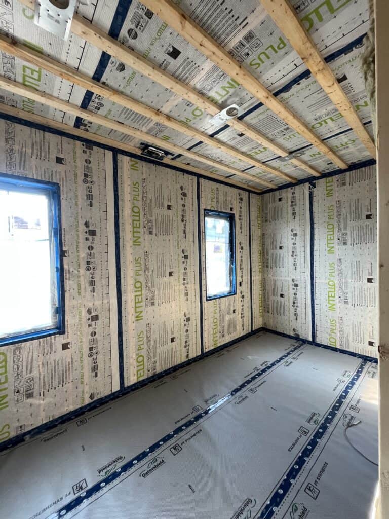 Continuous air barrier installation on a residential build in Owen Sound by Boulder and Beam