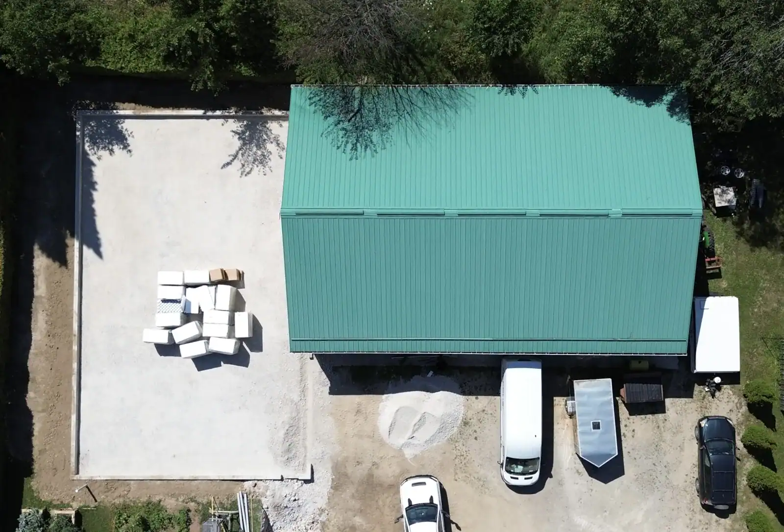 Aerial view of a newly built workshop with fresh gravel pad